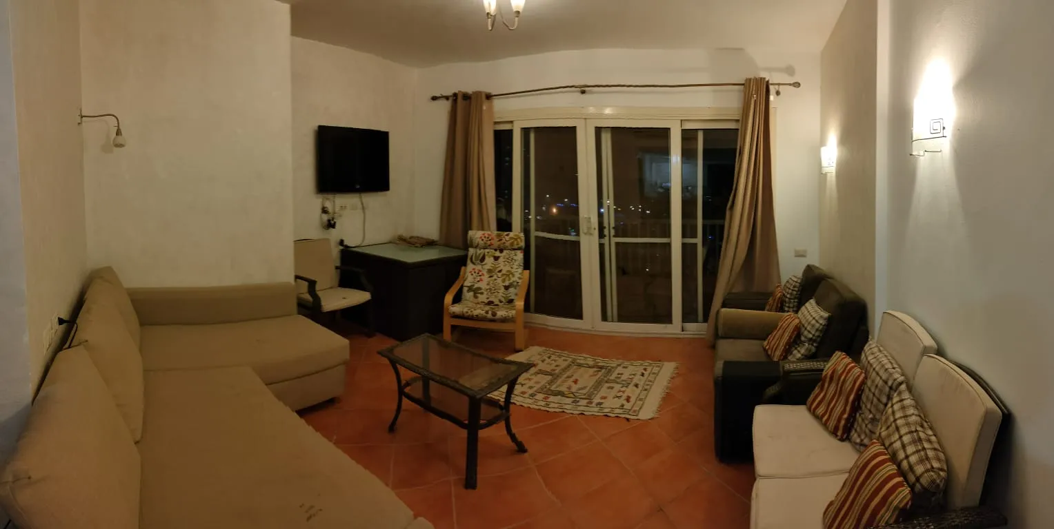 Living room with sofas and balcony doors - chalet in Porto Al Sokhna, Ain Sokhna