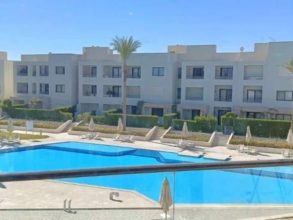 Pool view from the window in the Azha chalet - فيو حمام السباحة من شباك شاليه أزها