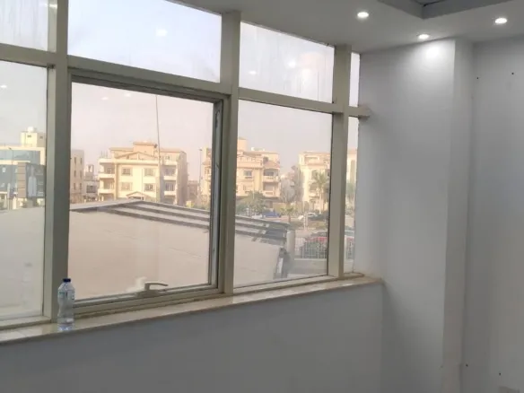 Main entrance of the Heartwork building in iCity where the office is for sale | المدخل الرئيسي لمبنى هارت وورك في آي سيتي حيث يوجد المكتب للبيع