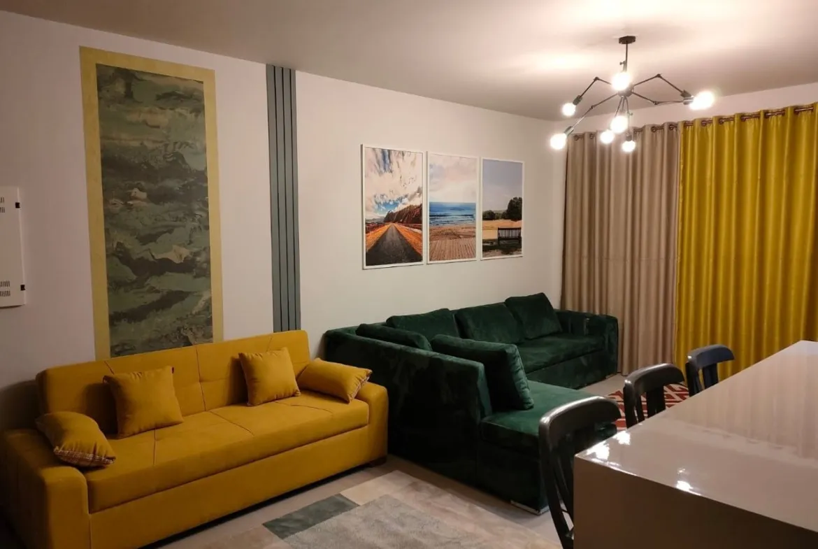 Living room with yellow and green sofas - chalet in Marassi Marina 1, North Coast