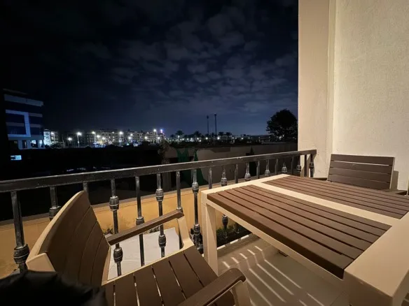 Terrace seating and evening view, apartment for rent in Mivida Avenues, New Cairo | جلسة التراس والإطلالة المسائية، شقة للإيجار في ميفيدا إفينوز، القاهرة الجديدة