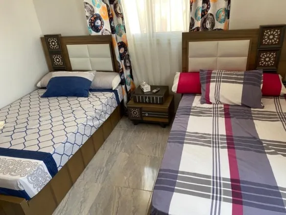 Two-bed bedroom in the furnished La Jolie Marina chalet for sale | غرفة نوم بسريرين في شاليه لا جولي مارينا المفروش للبيع