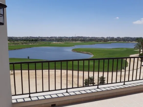 Balcony railing overlooking landscaped water features in Marassi, North Coast