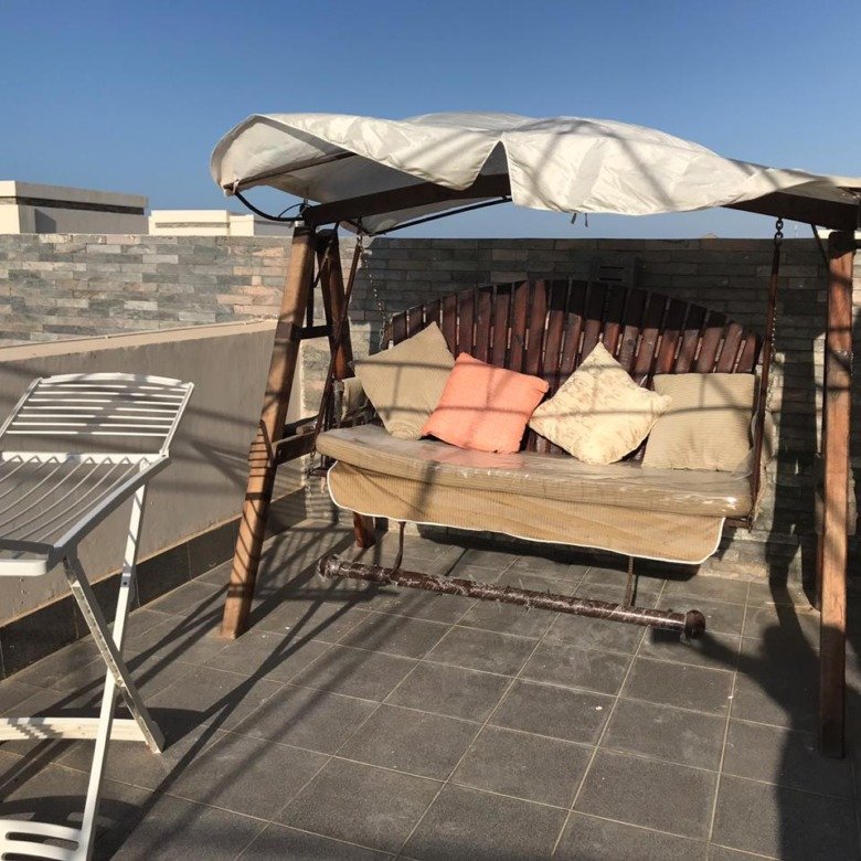 Roof terrace swing seat with canopy - penthouse in Amwaj, North Coast