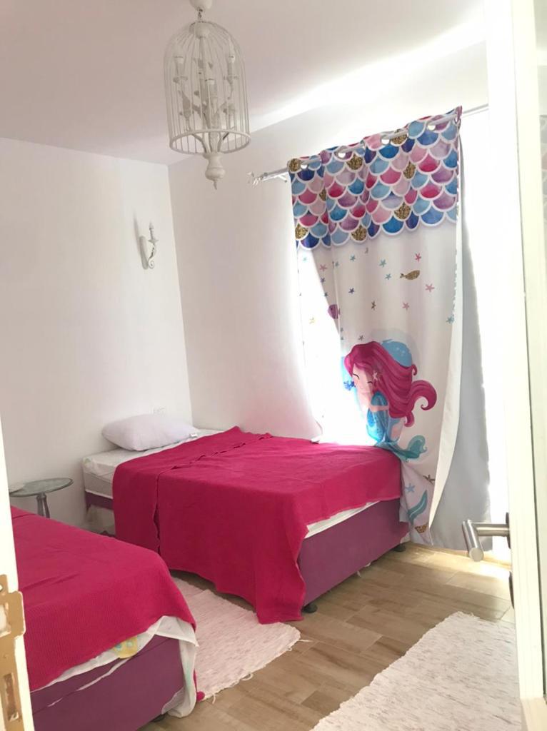 52-03-1514-source-07 Child bedroom with pink beds and cartoon curtain - chalet in Rhodes, North Coast