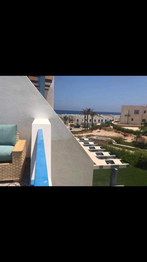 56-07-1514-source-09 Balcony view of the pool and sea - chalet in Rhodes, North Coast