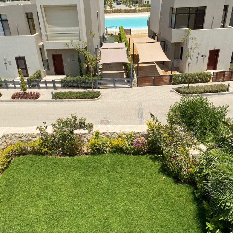 Garden and lagoon-facing outlook, corner townhouse for sale in Azha, Ain Sokhna