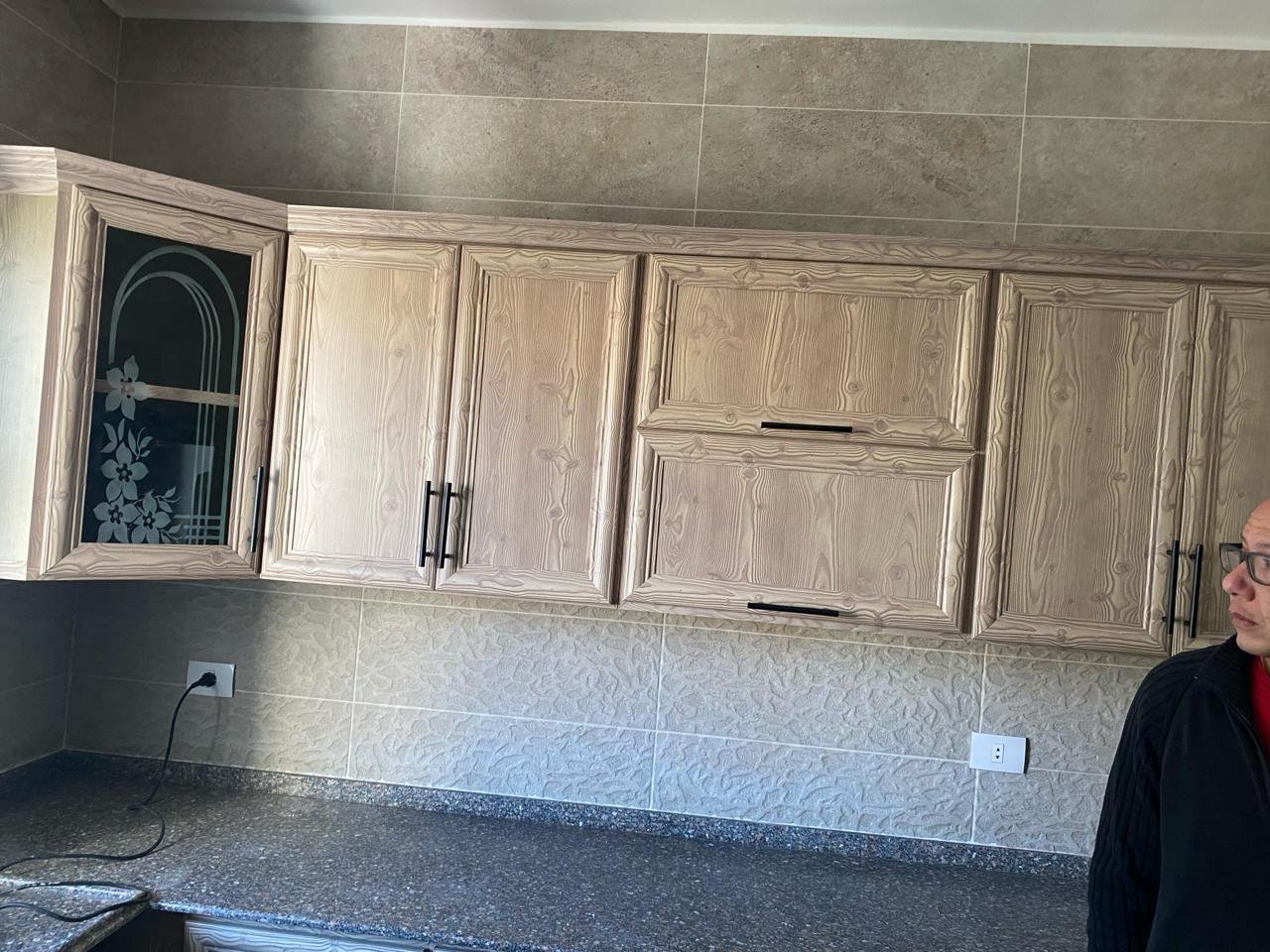 Kitchen with wooden cabinets and granite counter - apartment in Fifth Square, New Cairo