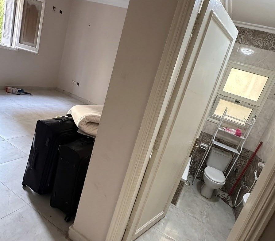 Room with a bathroom door open to the side - apartment in Sahafeen Compound, New Cairo