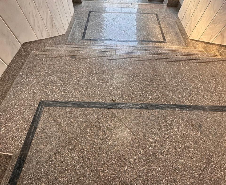 Granite-chip entrance floor with a dark border - apartment in Sahafeen Compound, New Cairo