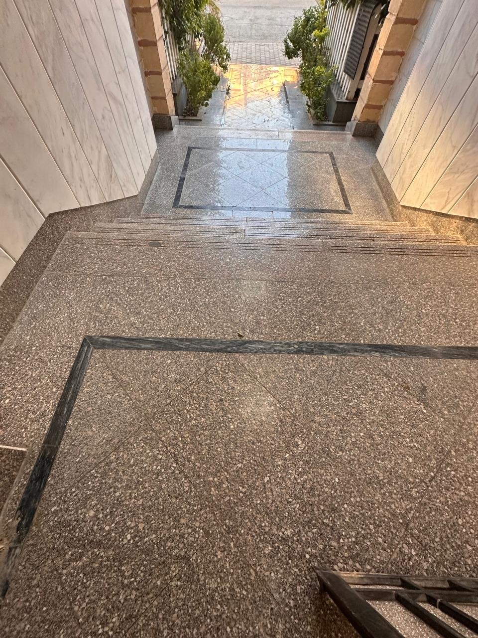 Granite-chip entrance floor with a dark border - apartment in Sahafeen Compound, New Cairo