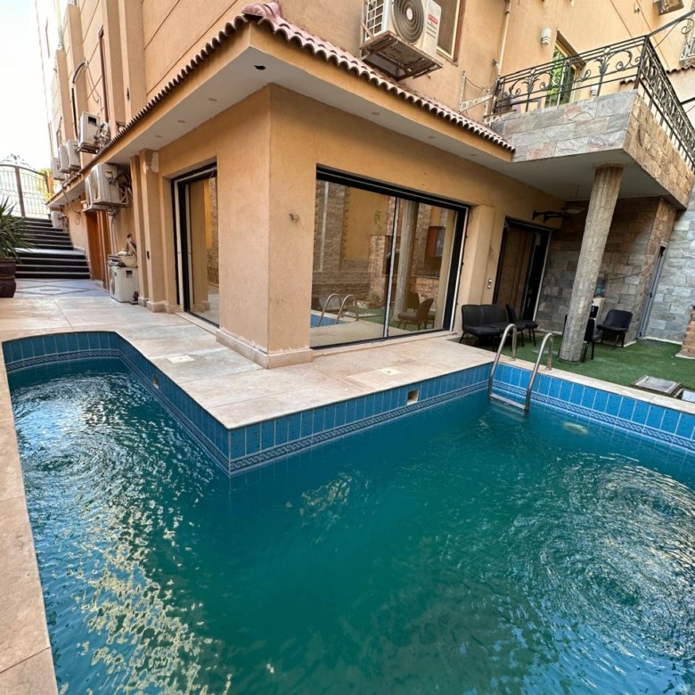 Private pool at a duplex for sale in Yasmeen 6, First Settlement