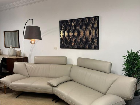 Living room with a light sofa in an apartment for sale in Al Maqsid, New Capital