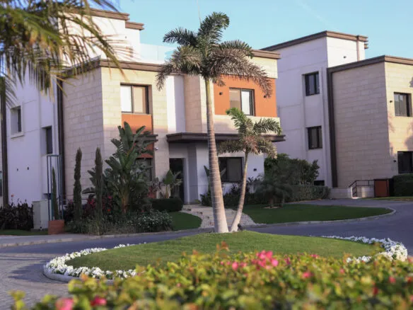 Townhouse buildings and landscaped street inside Azzar compound New Cairo | مباني التاون هاوس وشارع باللاندسكيب داخل كمبوند أزار القاهرة الجديدة