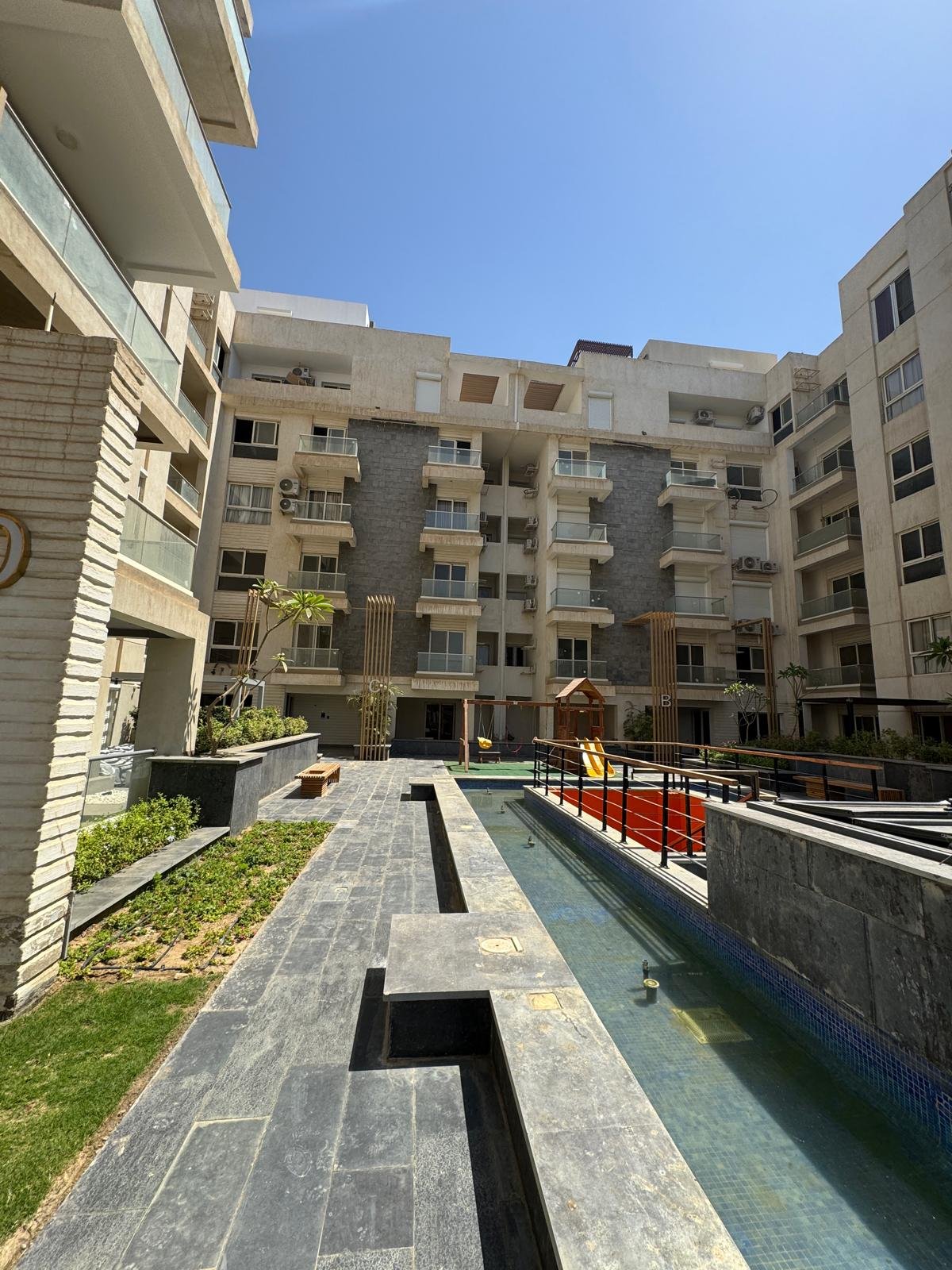 10-icity-clubpark-apartment-sale-349-00 Landscaped residential courtyard, apartment for sale in Mountain View iCity Club Park, New Cairo | الساحة السكنية واللاندسكيب، شقة للبيع في ماونتن فيو إي سيتي كلوب بارك، القاهرة الجديدة