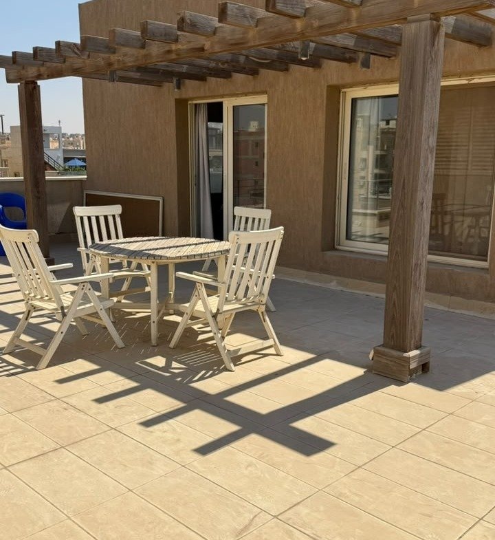 Roof terrace under pergola, The Village penthouse for sale | تراس الروف تحت البرجولة، بنتهاوس للبيع في ذا فيلدج