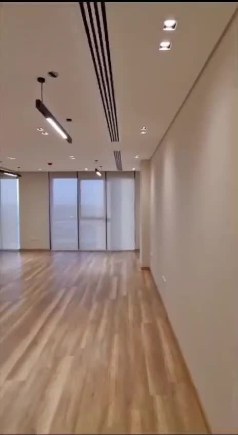 Empty room with large windows - office in Hyde Park, New Cairo