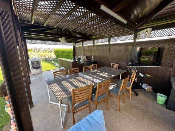 Covered outdoor seating and garden, villa for rent in Marassi Blanca Views, North Coast | جلسة خارجية مغطاة والحديقة، فيلا للإيجار في مراسي بلانكا فيوز، الساحل الشمالي