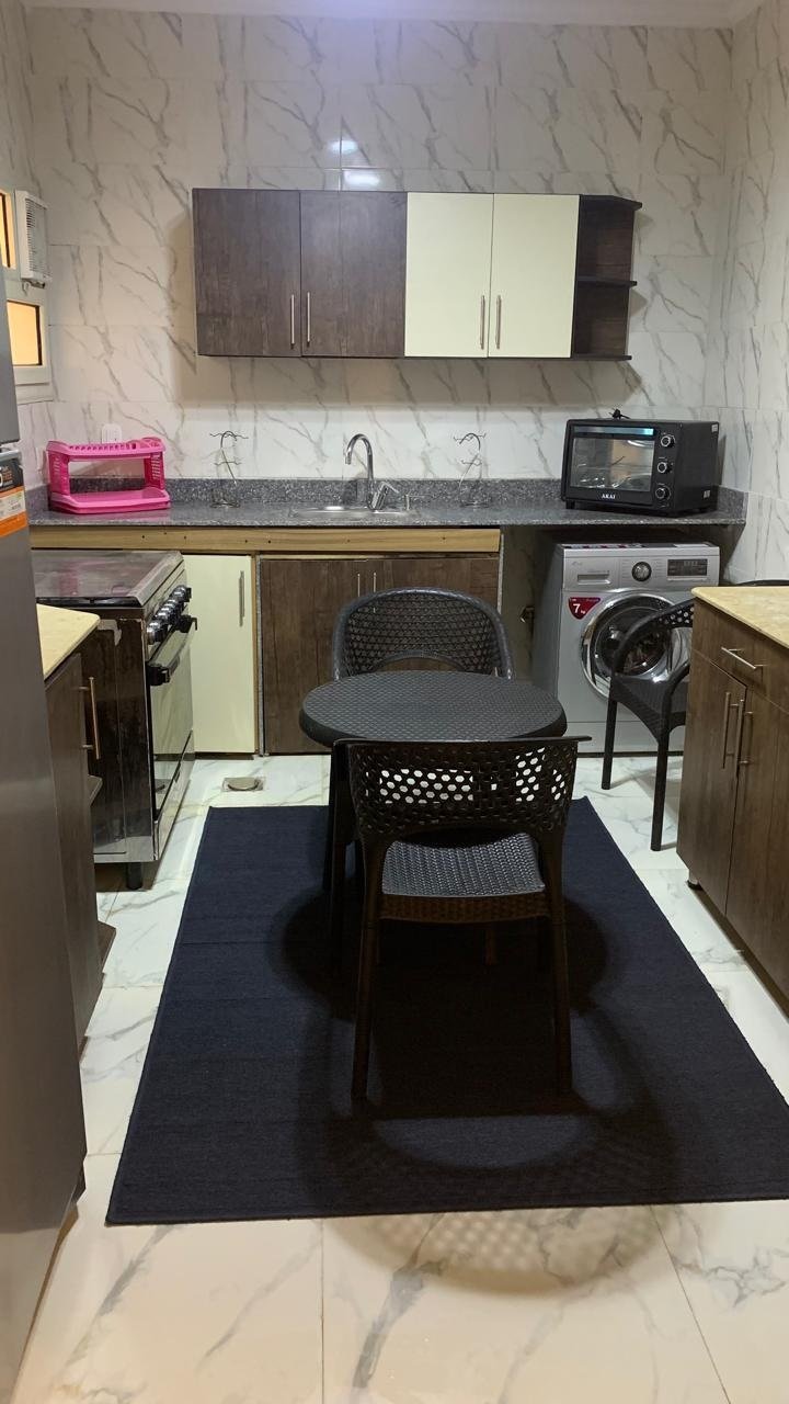 13-andalos-furnished-rent-256-05 Equipped kitchen and dining table, furnished apartment for rent in El-Andalos, Fifth Settlement | مطبخ مجهز وطاولة طعام، شقة مفروشة للإيجار في الأندلس بالتجمع الخامس
