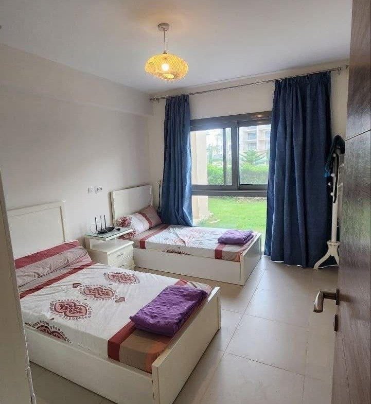 Bedroom with two beds, Marassi Marina 2 North Coast chalet for rent | غرفة بسريرين، شاليه للإيجار في مراسي مارينا 2 الساحل الشمالي