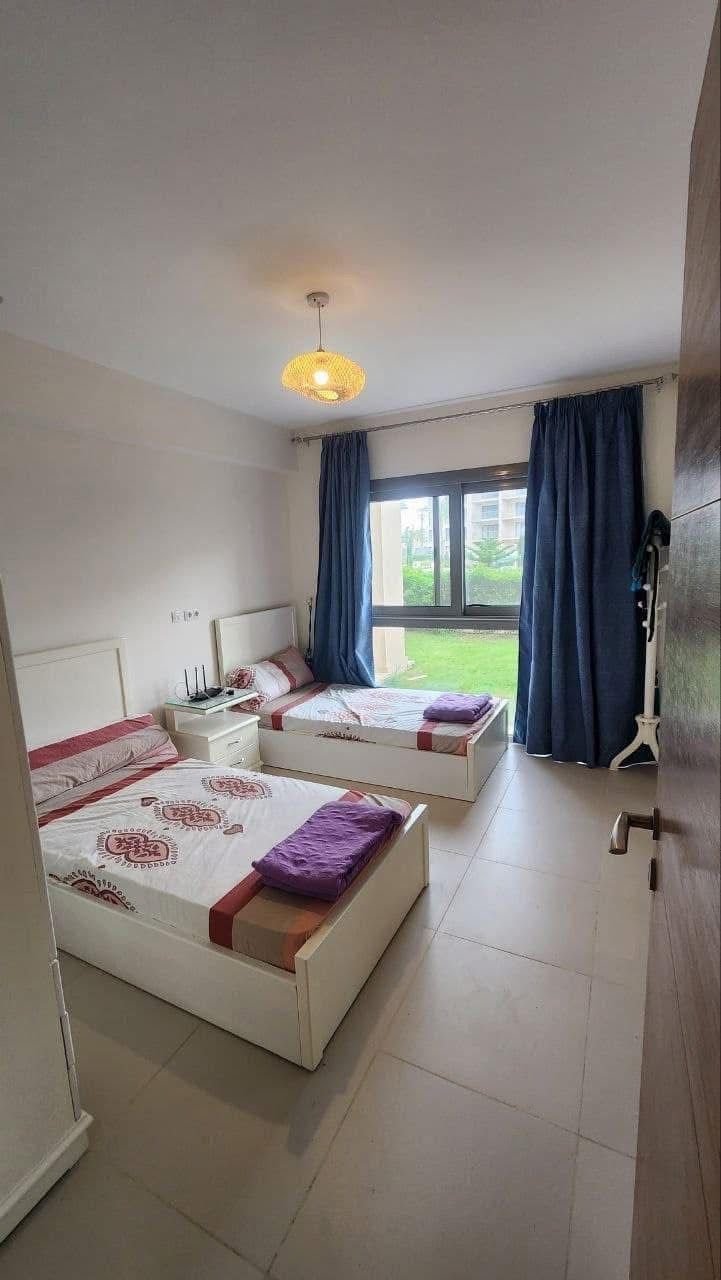 Bedroom with two beds, Marassi Marina 2 North Coast chalet for rent | غرفة بسريرين، شاليه للإيجار في مراسي مارينا 2 الساحل الشمالي