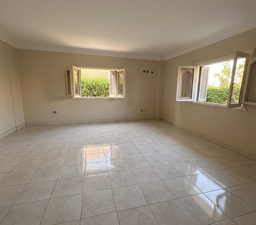 Empty tiled room with two windows - apartment in Sahafeen Compound, New Cairo