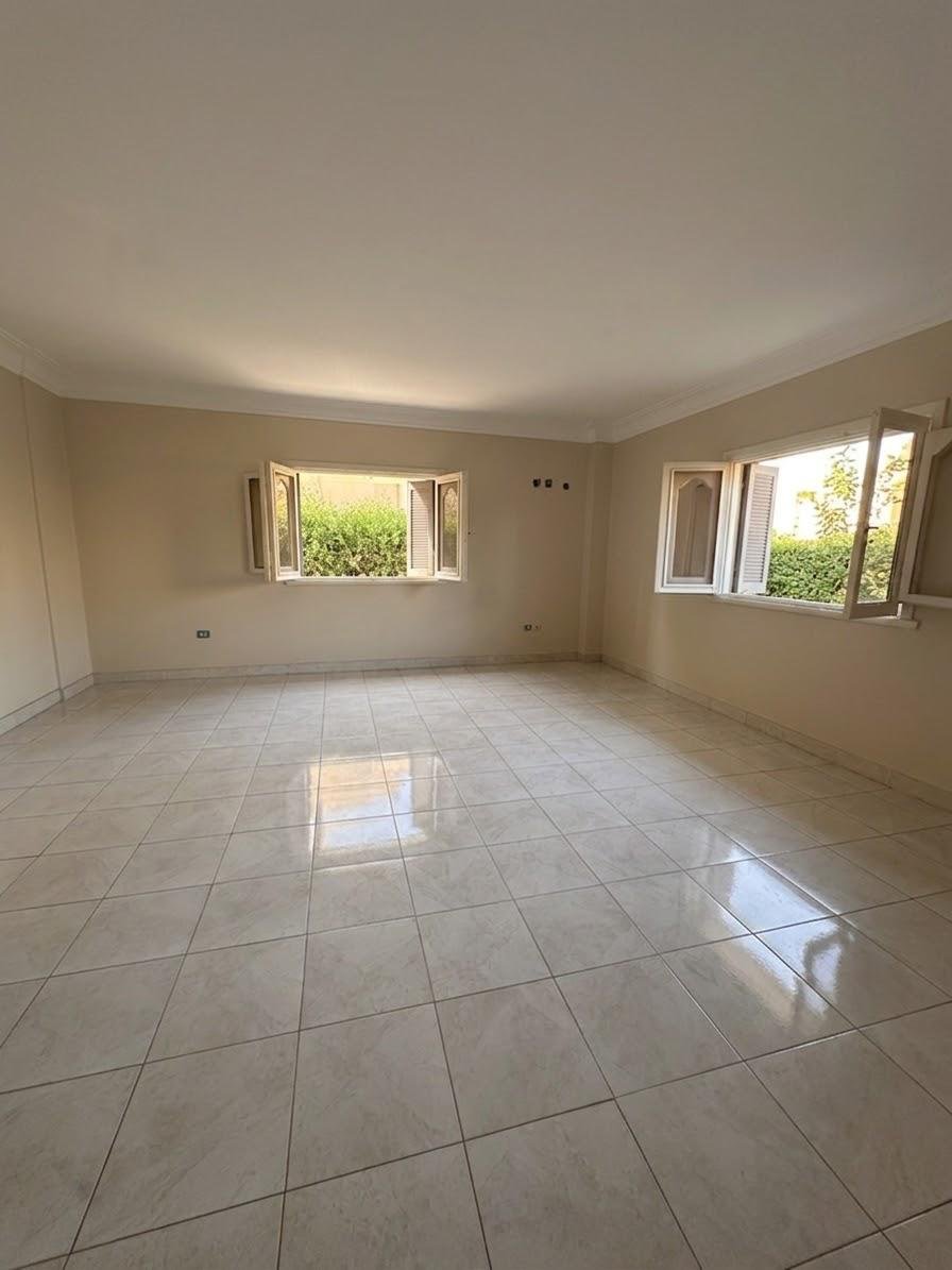 Empty tiled room with two windows - apartment in Sahafeen Compound, New Cairo