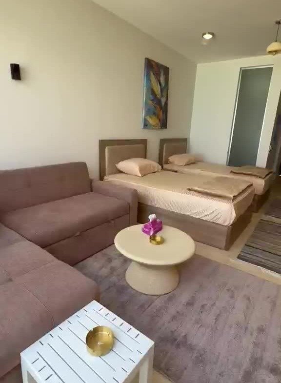 Furnished sleeping and seating area of the cabana | منطقة النوم والجلوس المفروشة بالكابانا