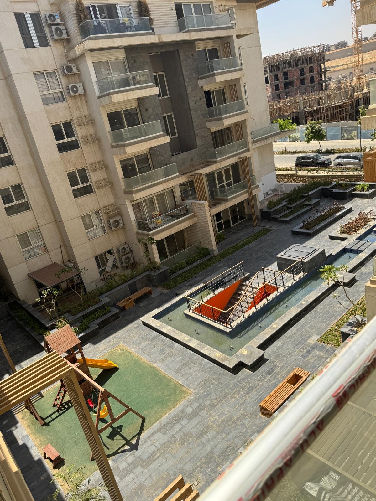 14-icity-clubpark-apartment-sale-349-04 Courtyard view from the apartment, apartment for sale in Mountain View iCity Club Park, New Cairo | إطلالة الساحة من الشقة، شقة للبيع في ماونتن فيو إي سيتي كلوب بارك، القاهرة الجديدة