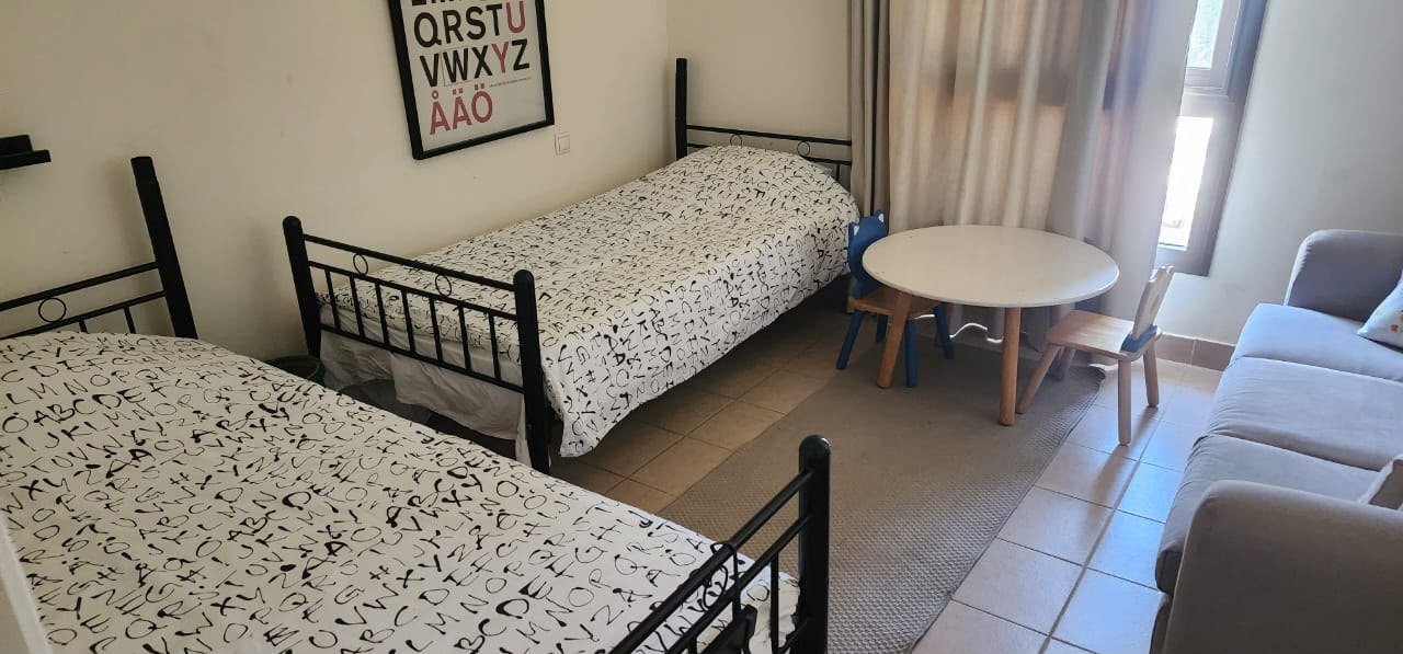 Bedroom with single beds, chalet for rent in Marassi Catania, North Coast | غرفة نوم بأسرة فردية، شاليه للإيجار في مراسي كاتانيا، الساحل الشمالي