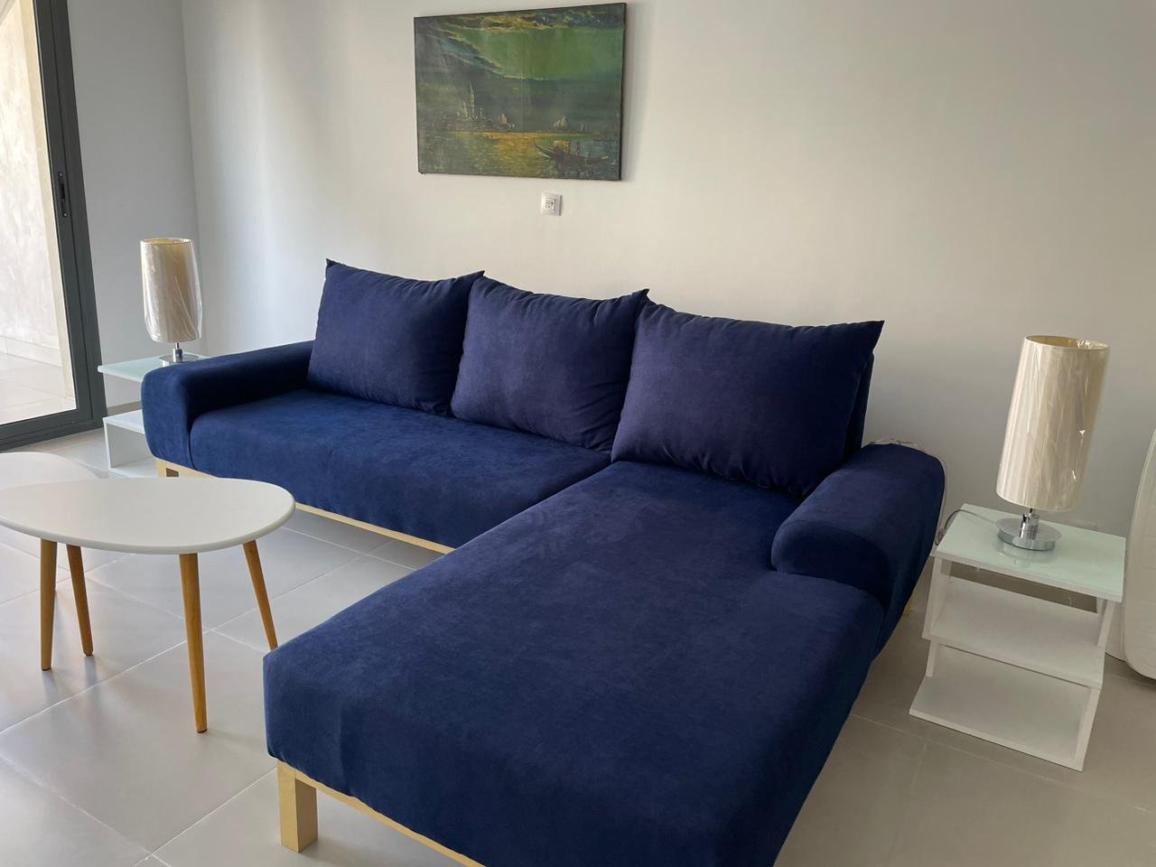 14-marassi-marina-281-21 Blue sofa and living area, second-floor chalet for rent in Marassi Marina 1, Sidi Abd El Rahman, North Coast - R&C Estate | صوفا زرقاء ومنطقة المعيشة، شاليه دور ثانٍ للإيجار في مراسي مارينا 1، سيدي عبد الرحمن، الساحل الشمالي - R&C Estate