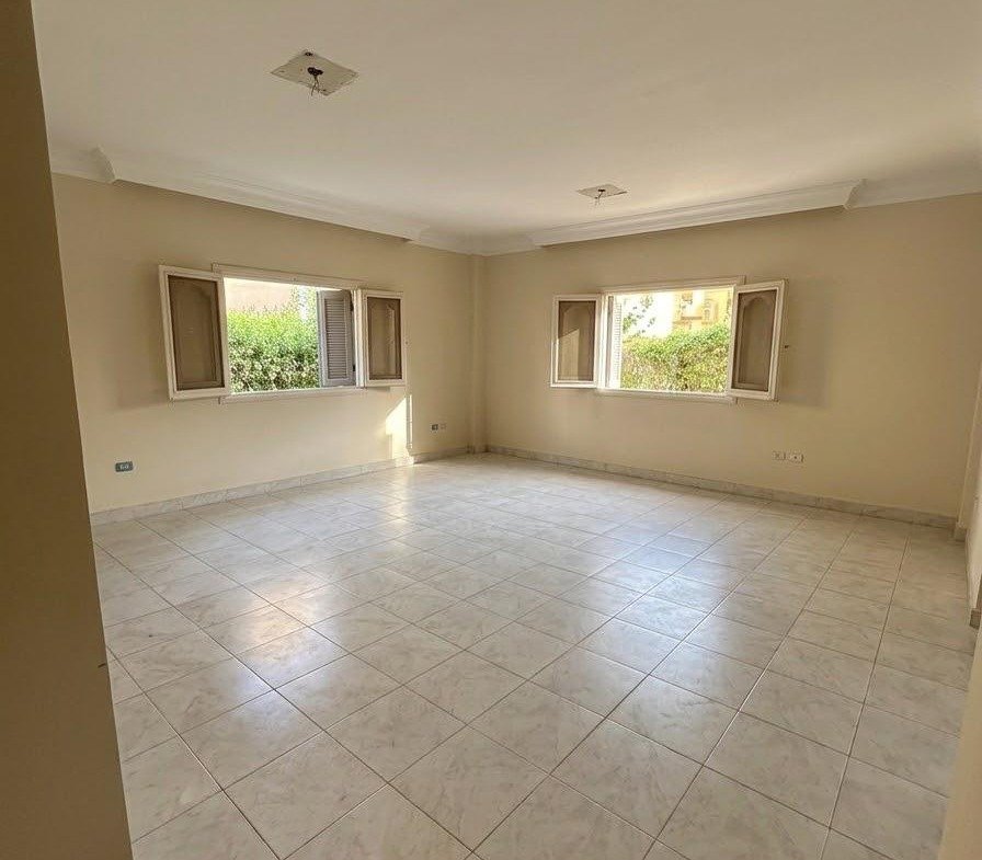 Empty room with a glossy tile floor seen from the door - apartment in Sahafeen Compound, New Cairo