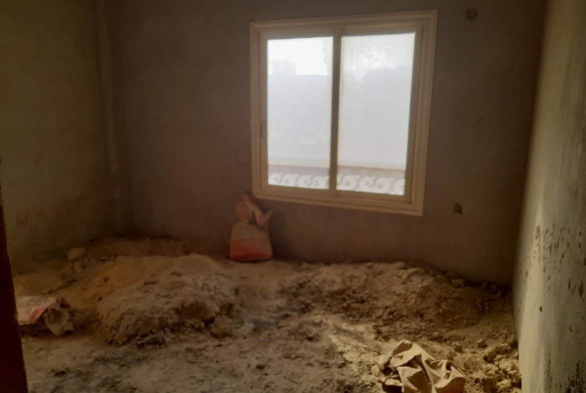 Rough room with a window and a pile of sand - penthouse in Green House, 5th Settlement
