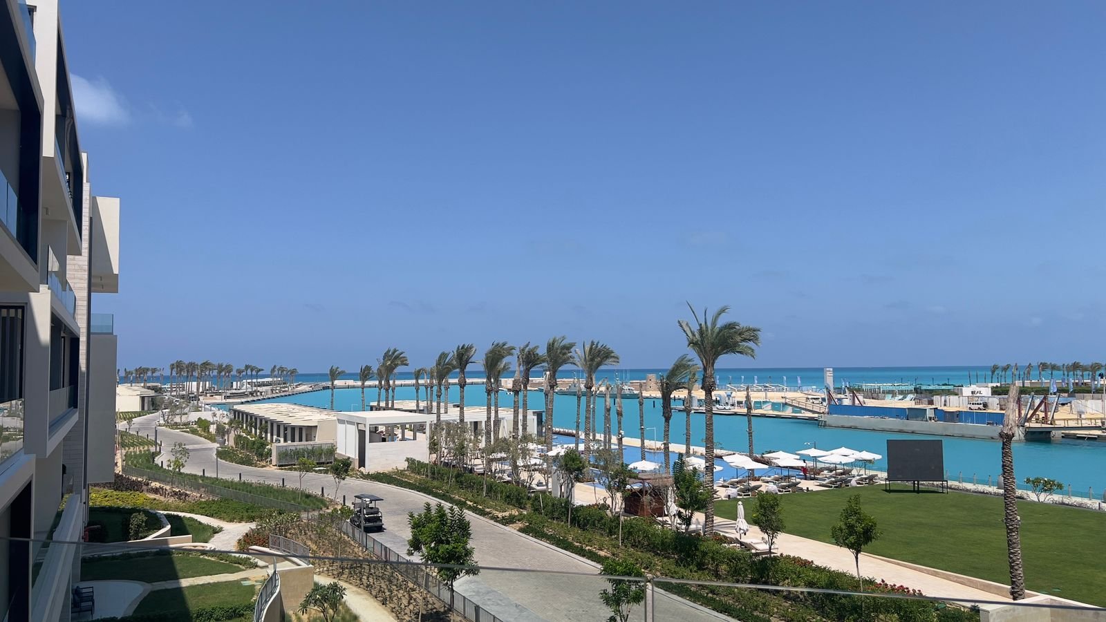 Waterfront and palm trees viewed from the balcony in Marassi, North Coast
