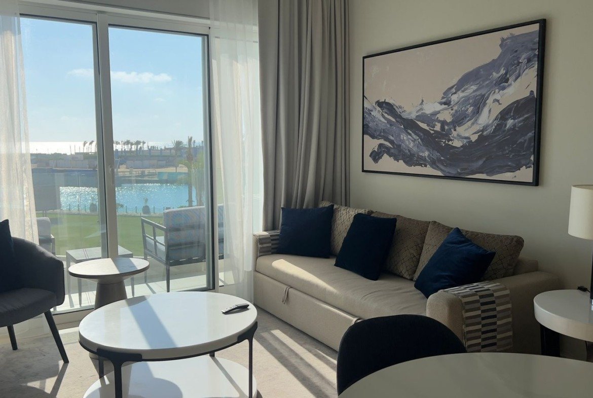 Living room with sofa and round tables in Marassi, North Coast