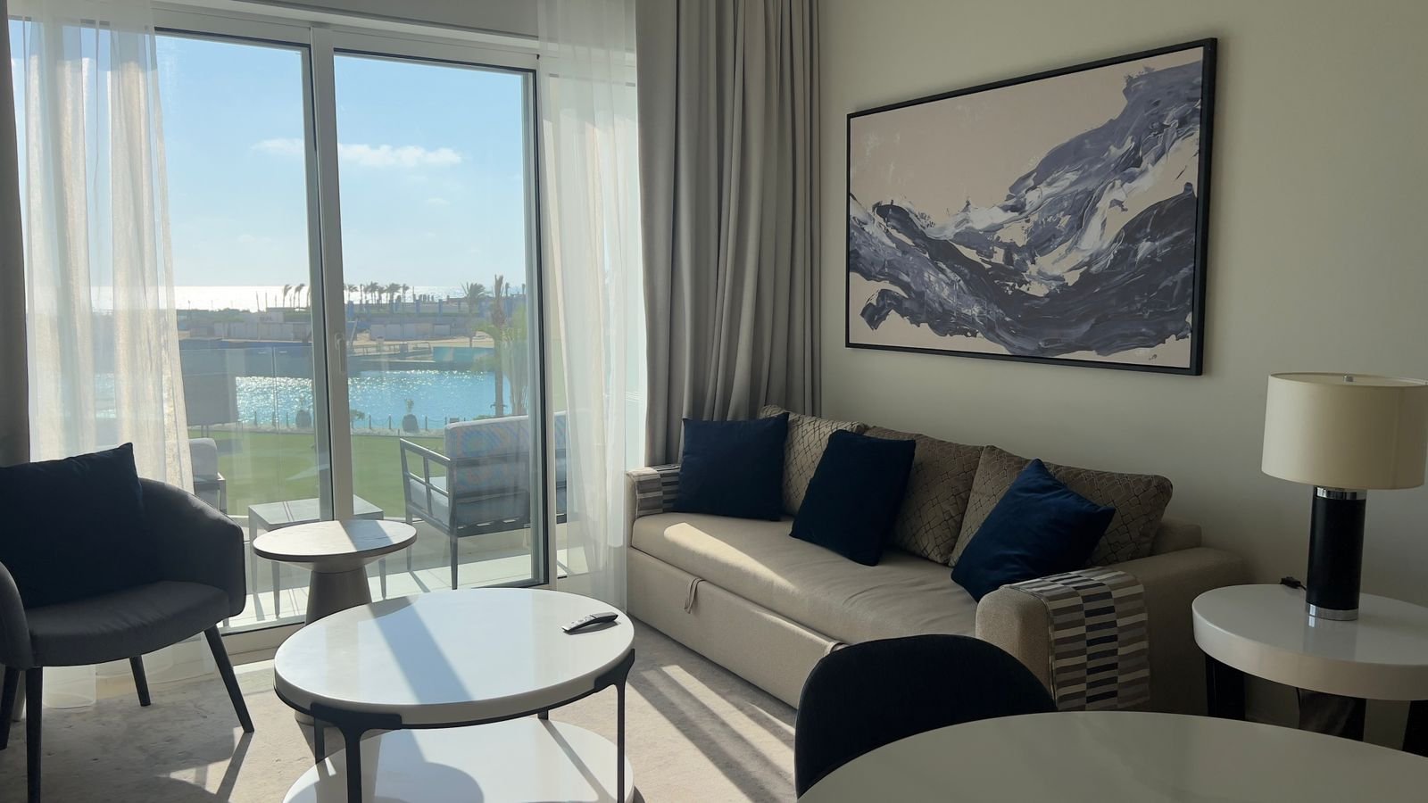 Living room with sofa and round tables in Marassi, North Coast