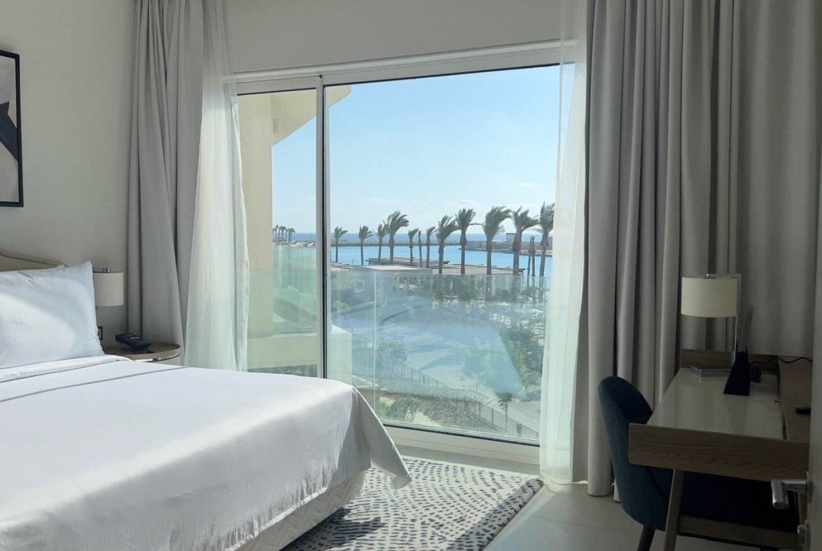 Bedroom opening onto the balcony in Marassi, North Coast