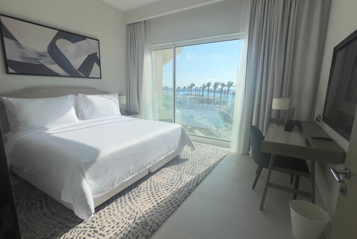 Bedroom with a waterfront balcony in Marassi, North Coast