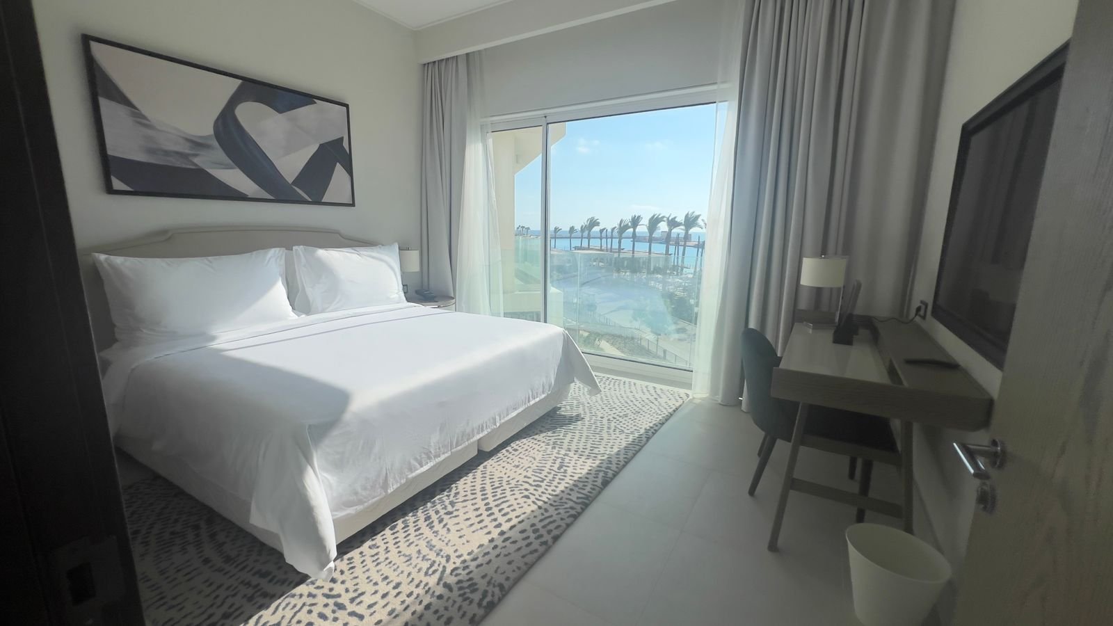 Bedroom with a waterfront balcony in Marassi, North Coast