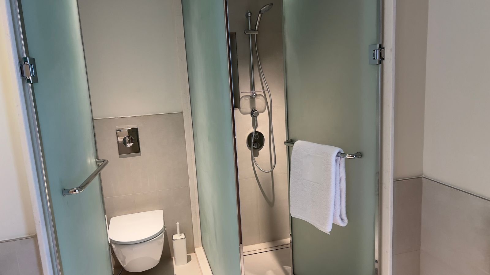 Toilet and glass shower enclosure in Marassi, North Coast