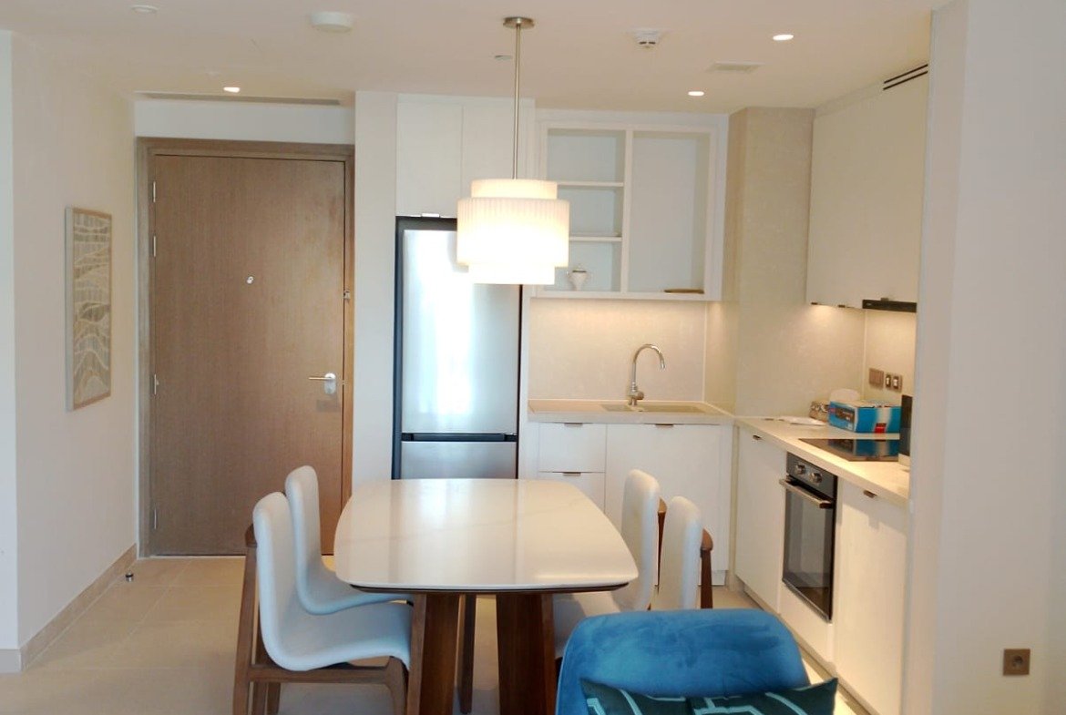 Dining table and open kitchen in Marassi, North Coast