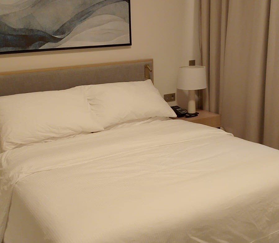 Bed with white linen in Marassi, North Coast