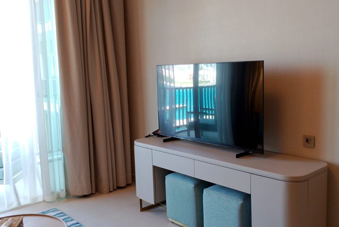 Television cabinet beside the balcony doors in Marassi, North Coast