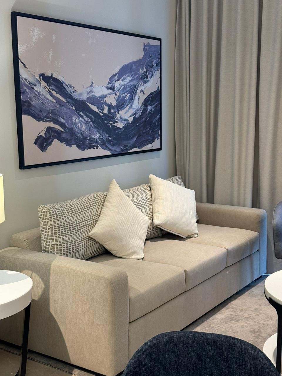 Sofa beneath framed artwork in Marassi, North Coast