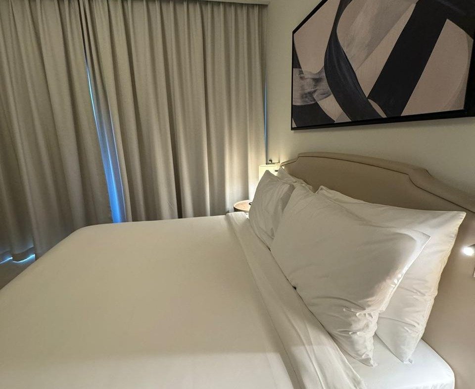 Bed with white pillows in Marassi, North Coast