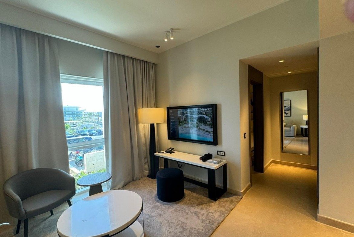 Television and seating beside a window in Marassi, North Coast