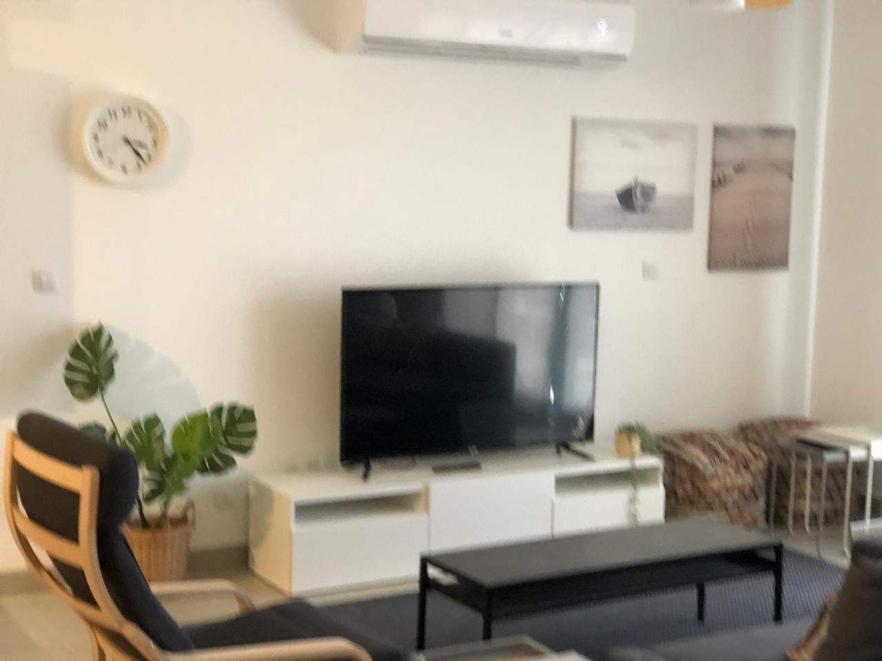 Reception television and seating, chalet for sale in Marassi Marina 1, North Coast | تلفزيون وجلسة الريسيبشن، شاليه للبيع في مراسي مارينا 1، الساحل الشمالي
