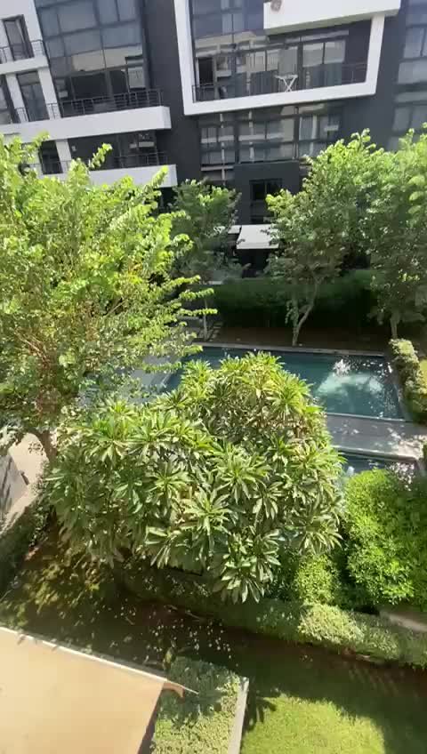 Water feature and landscaped view, apartment for sale in Waterway 1, New Cairo | إطلالة على المسطحات المائية والمساحات الخضراء، شقة للبيع في واتر واي 1، القاهرة الجديدة