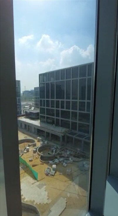 Window view toward a glass office block under construction - office in Cairo Festival City, New Cairo