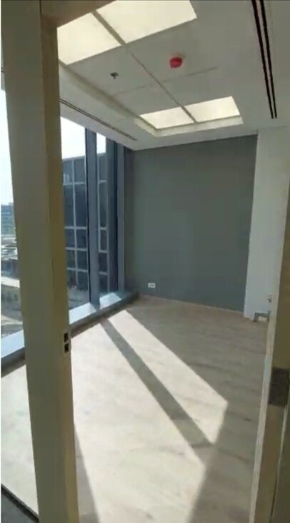 Office corner with floor-to-ceiling glass and ceiling vents - office in Cairo Festival City, New Cairo